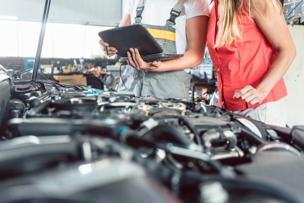 Mechanic using diagnostic tools.