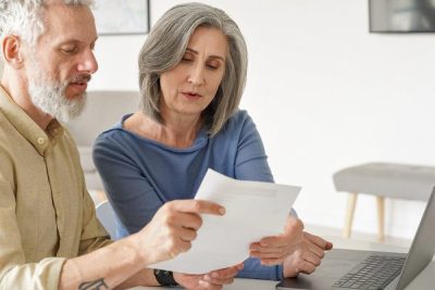 older couple checking pension tax